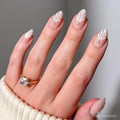 Honeymoon press-on nails set featuring elegant soft pink almond-shaped nails for a romantic look
